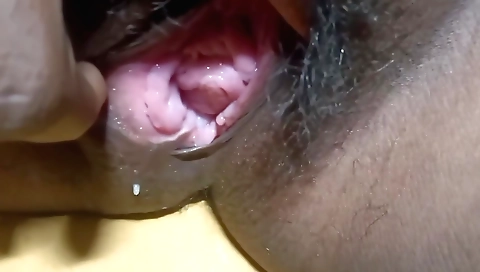 Hairy brunette is masturbating her hairy pussy and dildo