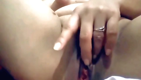 Hot brunette masturbating from behind in amateur vid