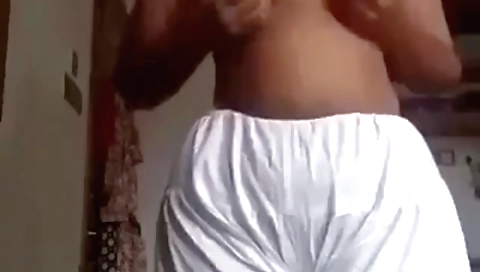 Busty babe wearing no clothes shows her hairy pussy