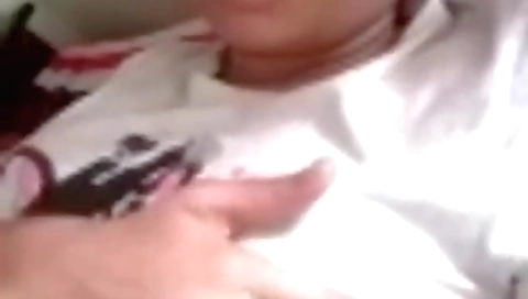 Busty brunette with big tits showing herself in bedroom