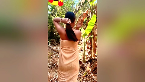 Brunette woman in the mud on the grass makes an amateur video