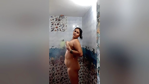 Indian mature milf undresses and masturbates in the shower