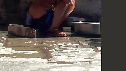 Sexy indian chick playing with fan and a fan in her dress