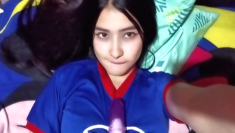 Young and attractive girl getting naked in her room