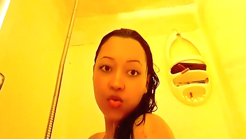 Busty brunette with a hairy pussy masturbating in the bath