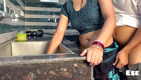 Indian chick gets her hungry pussy slapped in the kitchen