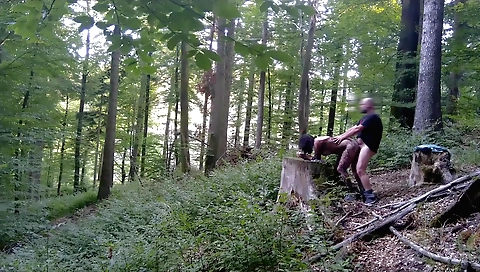 amateur brunette riding a bike in the city outdoors