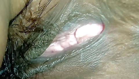 Indian hairy babe with a beautiful face is getting a handjob