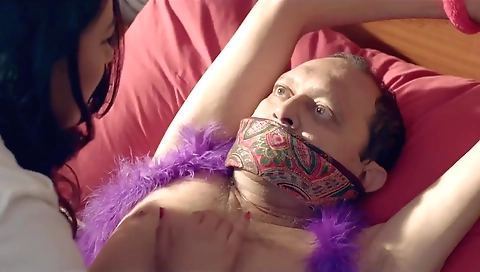 Doctor is on the sofa and performing fetish actions