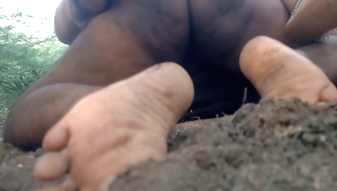 Naked woman in white dress and on the rock outdoors