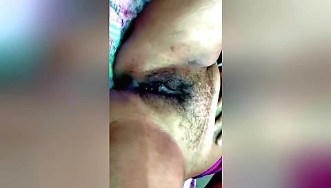 A solo video shows a hairy brunette in the bathroom