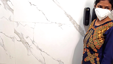 Sexy brunette girl in a white dress and panties in a bathroom