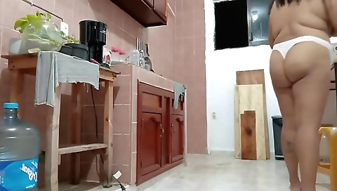 Stepmom shows her stepmommy tits and thong in the kitchen