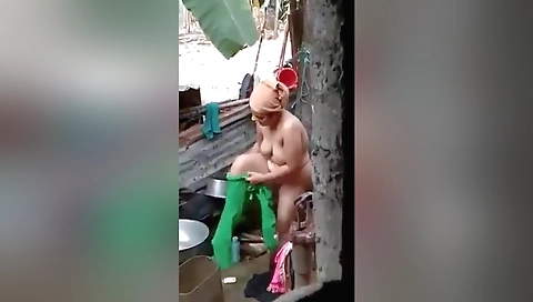 Chubby brunette naked outdoors after outdoor shower